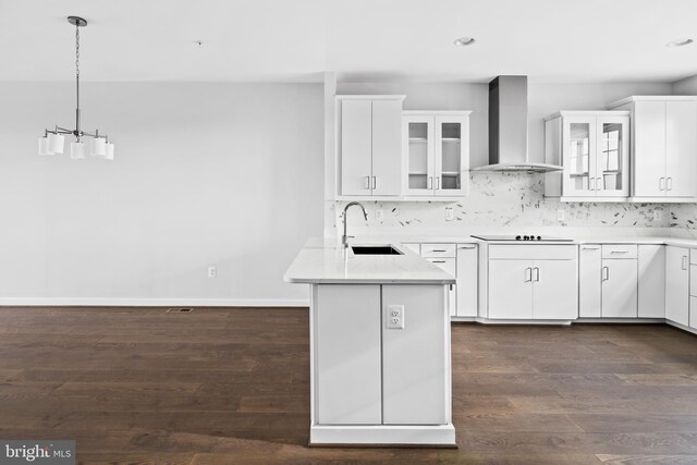 0 Triggerfish Dr, National Harbor, MD 20745 - kitchen with wall chimney exhaust hood, a peninsula, a sink, and white cabinetry