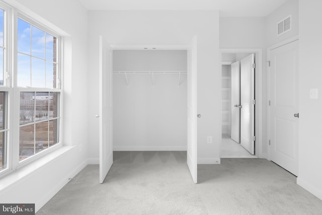 0 Triggerfish Dr, National Harbor, MD 20745 - unfurnished bedroom featuring baseboards, carpet flooring, visible vents, and a closet
