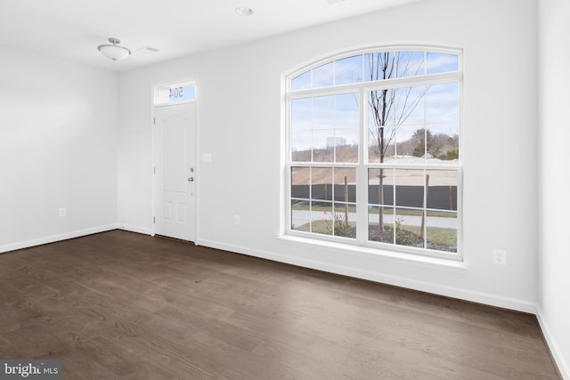 foyer with dark hardwood / wood-style floors