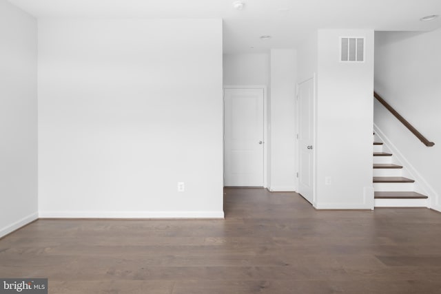 empty room featuring dark hardwood / wood-style floors