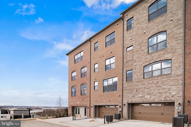 0 Triggerfish Dr, National Harbor, MD 20745 - view of building exterior featuring central AC, an attached garage, and driveway
