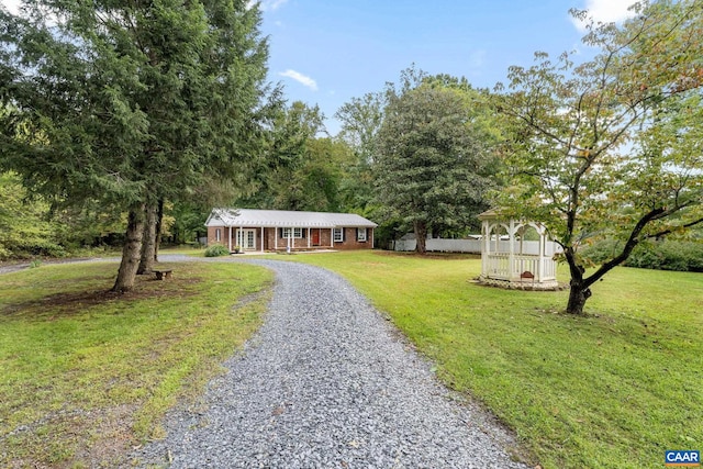 single story home featuring a front yard