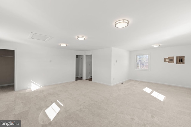 spare room with light colored carpet