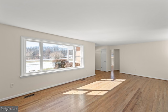 empty room with light wood-type flooring