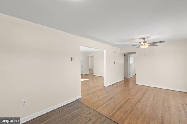 spare room featuring ceiling fan and light hardwood / wood-style floors