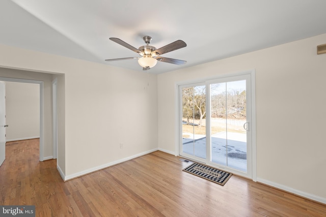 unfurnished room with ceiling fan and light hardwood / wood-style floors