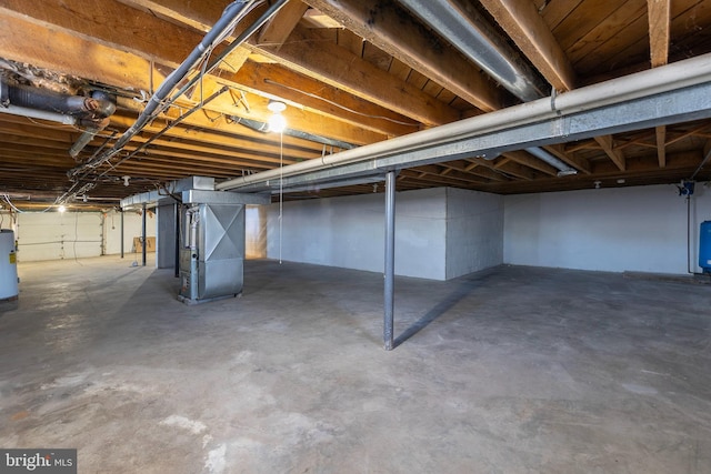 basement with heating unit and water heater