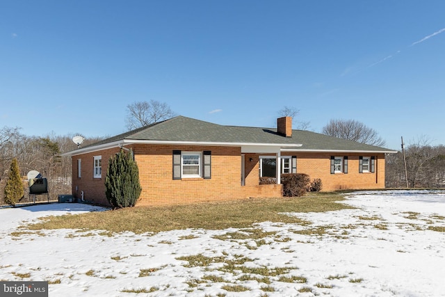 view of snow covered property