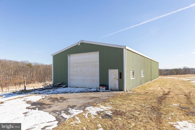 view of outbuilding with a garage