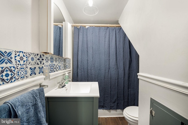 bathroom with vanity, hardwood / wood-style floors, and toilet