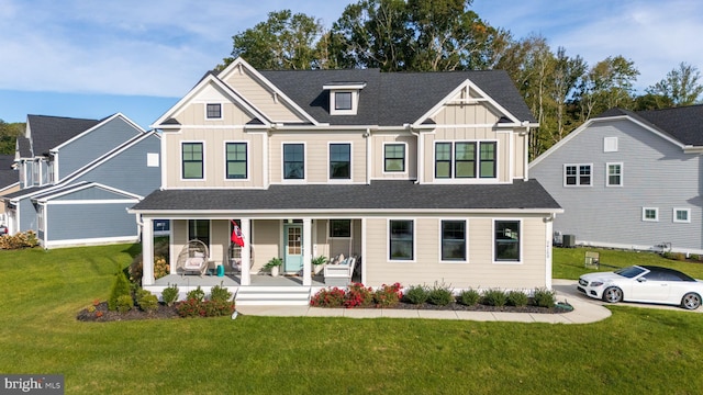 view of front facade featuring covered porch and a front lawn