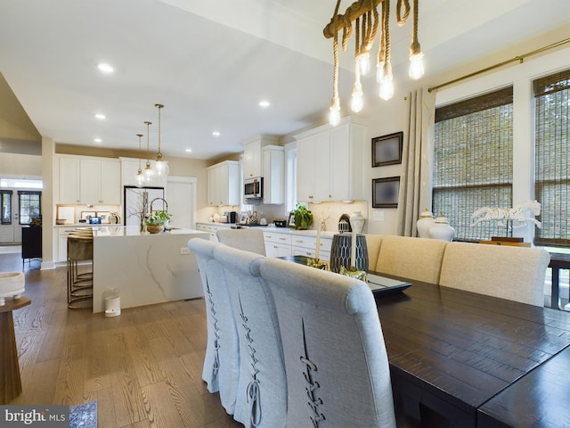 dining area featuring wood-type flooring