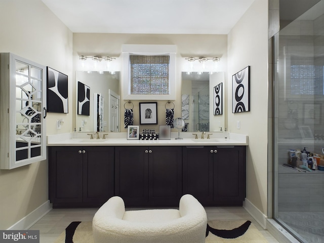 bathroom featuring vanity and an enclosed shower