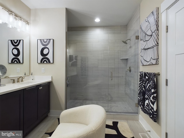 bathroom featuring vanity and walk in shower