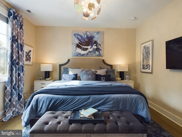 bedroom with wood-type flooring