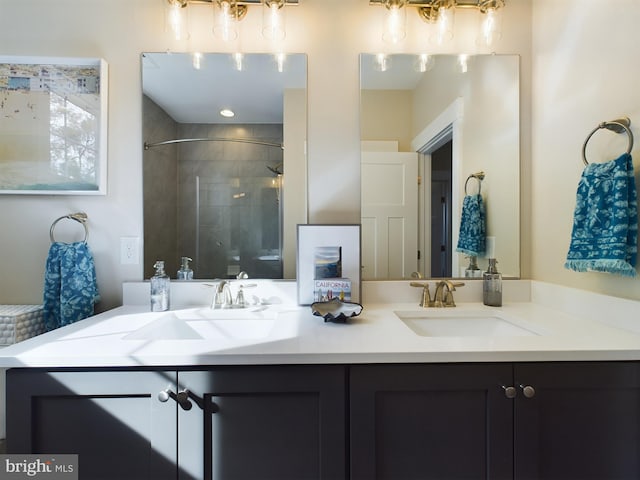 bathroom with vanity and an enclosed shower