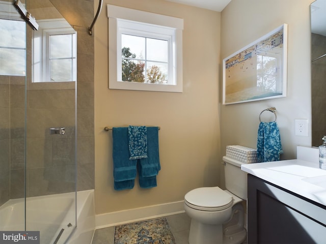 bathroom featuring vanity, toilet, and tile patterned floors