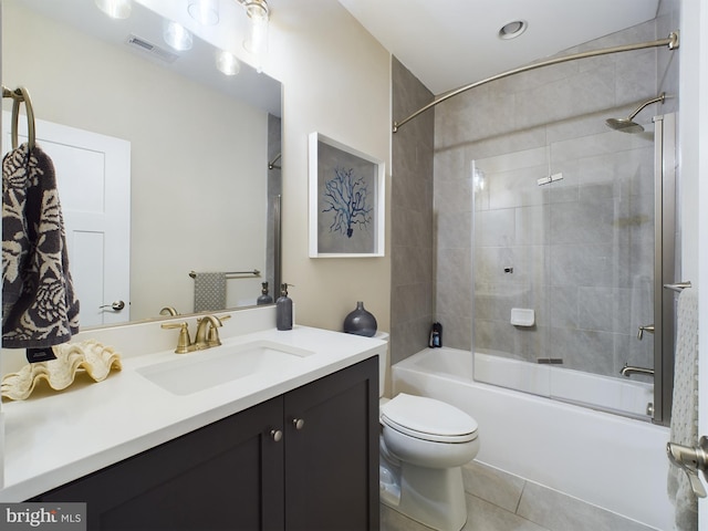 full bathroom with vanity, toilet, tile patterned floors, and tiled shower / bath combo