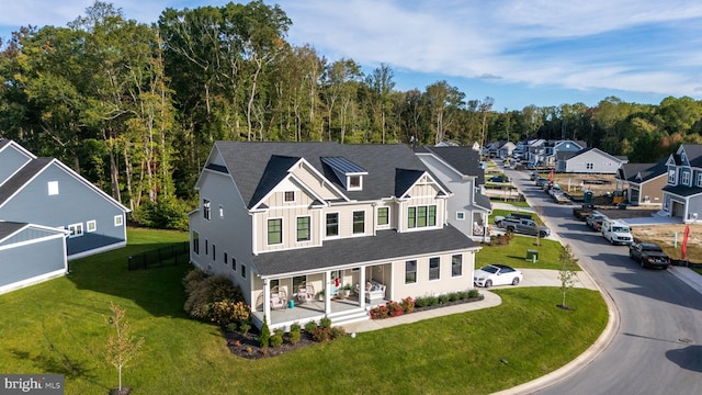 view of front of house with a front lawn and covered porch