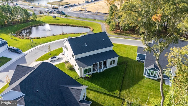 birds eye view of property featuring a water view