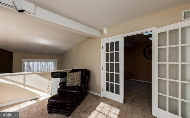 unfurnished room with french doors, lofted ceiling with beams, and carpet floors