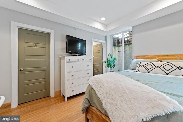 bedroom with light hardwood / wood-style flooring