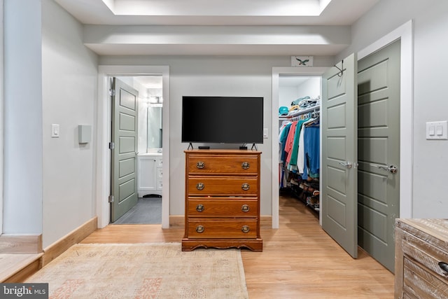 spacious closet featuring light wood-type flooring