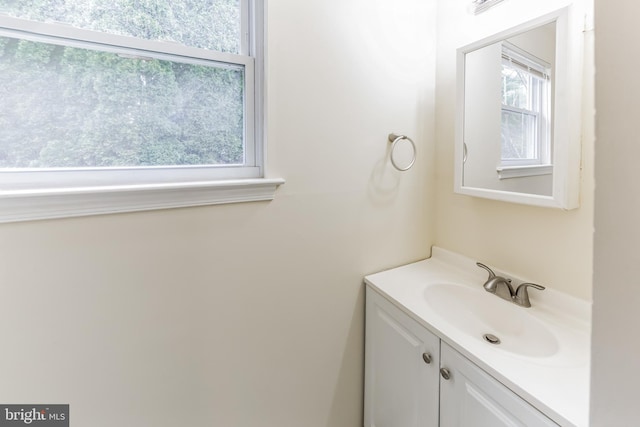 bathroom with vanity and a healthy amount of sunlight