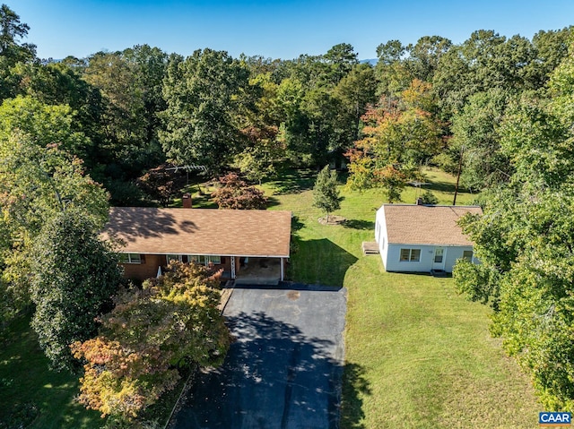 aerial view featuring a wooded view