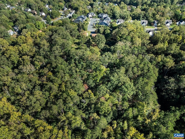 drone / aerial view featuring a view of trees