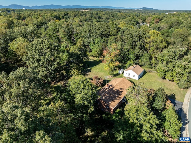 aerial view featuring a wooded view