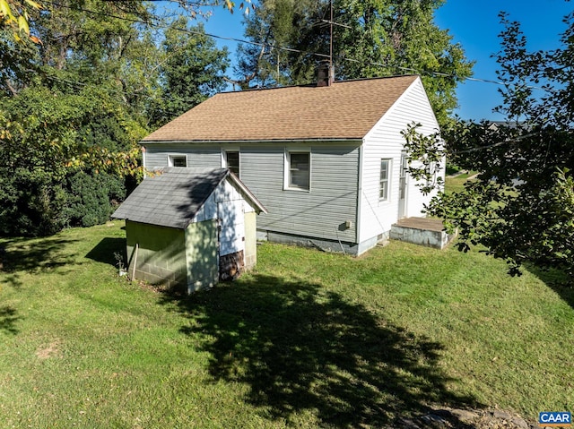 exterior space with a yard and a shed