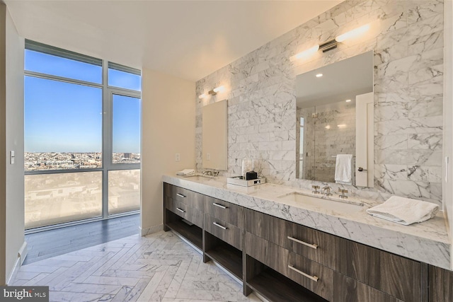 bathroom featuring tile walls, vanity, a tile shower, and wood-type flooring