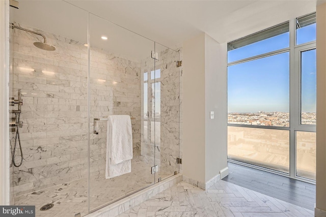 bathroom featuring hardwood / wood-style flooring and an enclosed shower