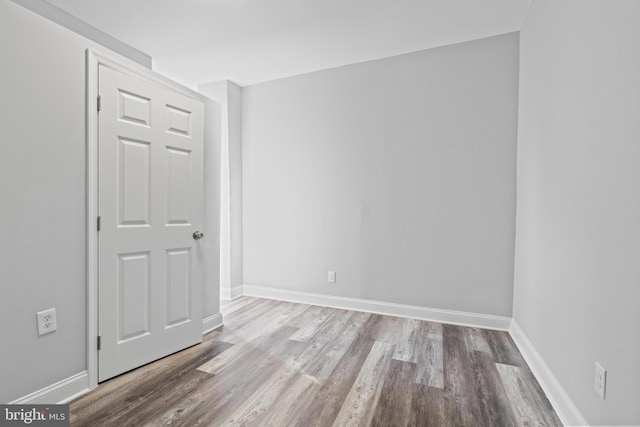 unfurnished room with light wood-type flooring