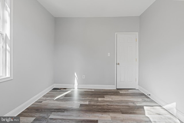 spare room featuring hardwood / wood-style flooring