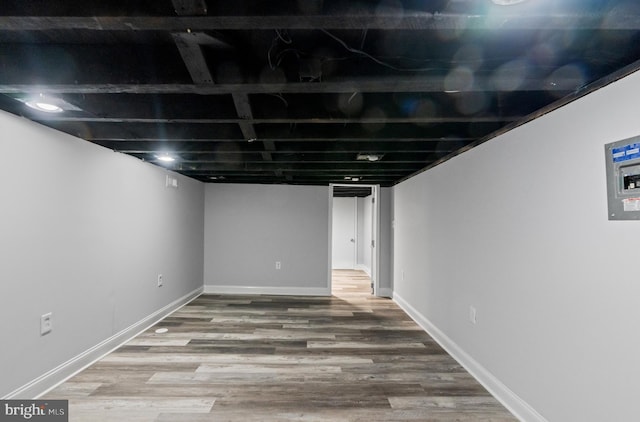 basement featuring hardwood / wood-style flooring