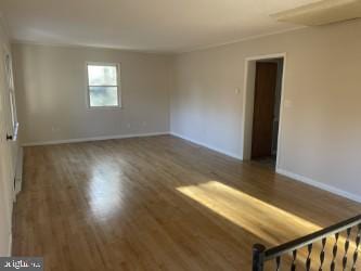 empty room with dark wood-type flooring