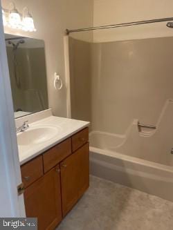 bathroom featuring vanity and tub / shower combination