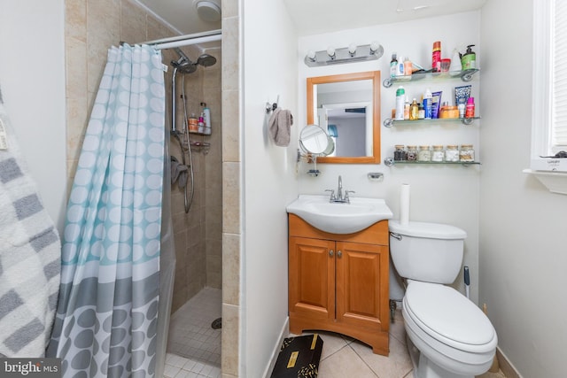 bathroom with toilet, curtained shower, vanity, and tile patterned floors