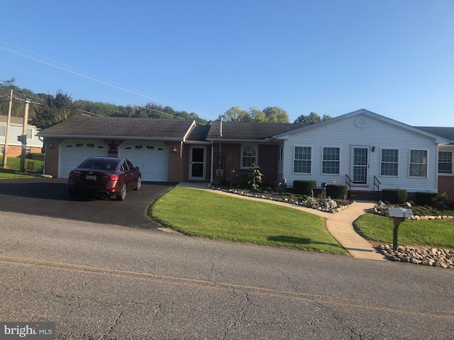 single story home with a front lawn and a garage