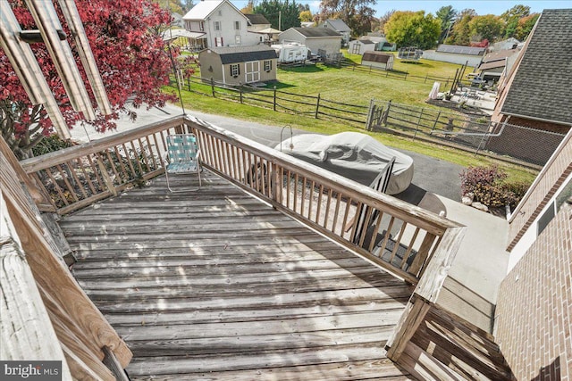 deck with a yard and a patio