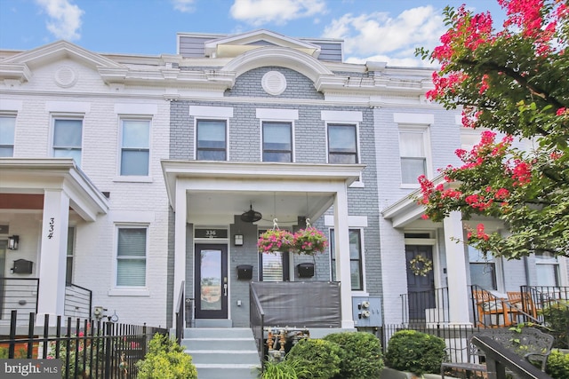 townhome / multi-family property with covered porch