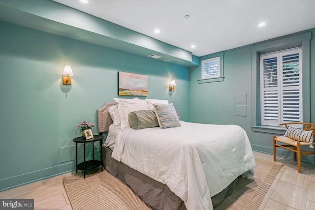 bedroom with light hardwood / wood-style floors