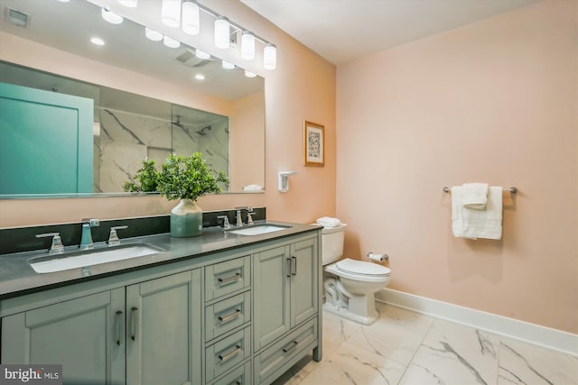 bathroom featuring vanity, toilet, and tiled shower