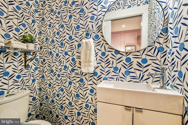 bathroom with vanity and toilet