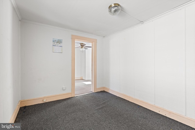 empty room with crown molding, carpet flooring, and ceiling fan