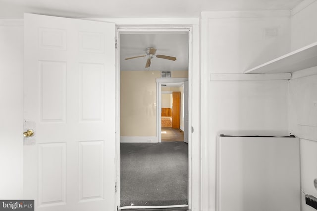 interior space with ceiling fan