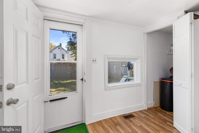 doorway to outside with light hardwood / wood-style flooring