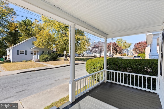 wooden terrace featuring a porch